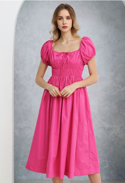 فستان ميدي بأكمام منفوخة ورقبة مربعة باللون الوردي الفاقع