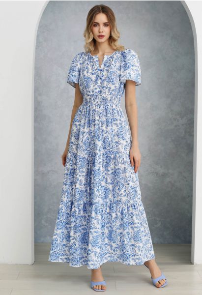 فستان طويل مطبوع عليه زهور زرقاء