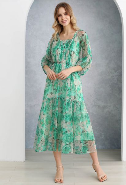 فستان دوللي بأكمام منفوخة ومطبوع عليه زهور باللون الأخضر