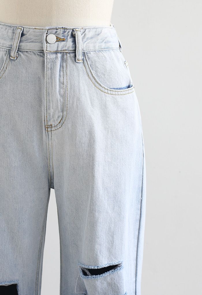 بنطال جينز ممزق واسع الساق