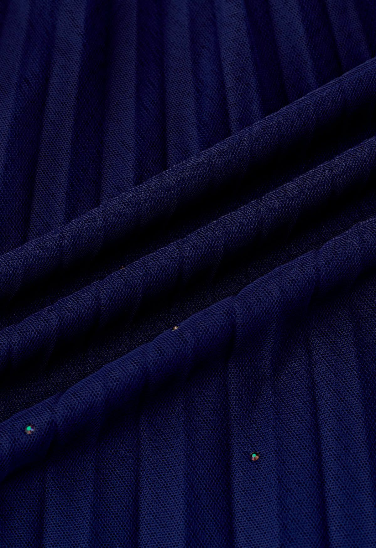 تنورة تول شبكية مزينة بالجليتر وطيات باللون الكحلي