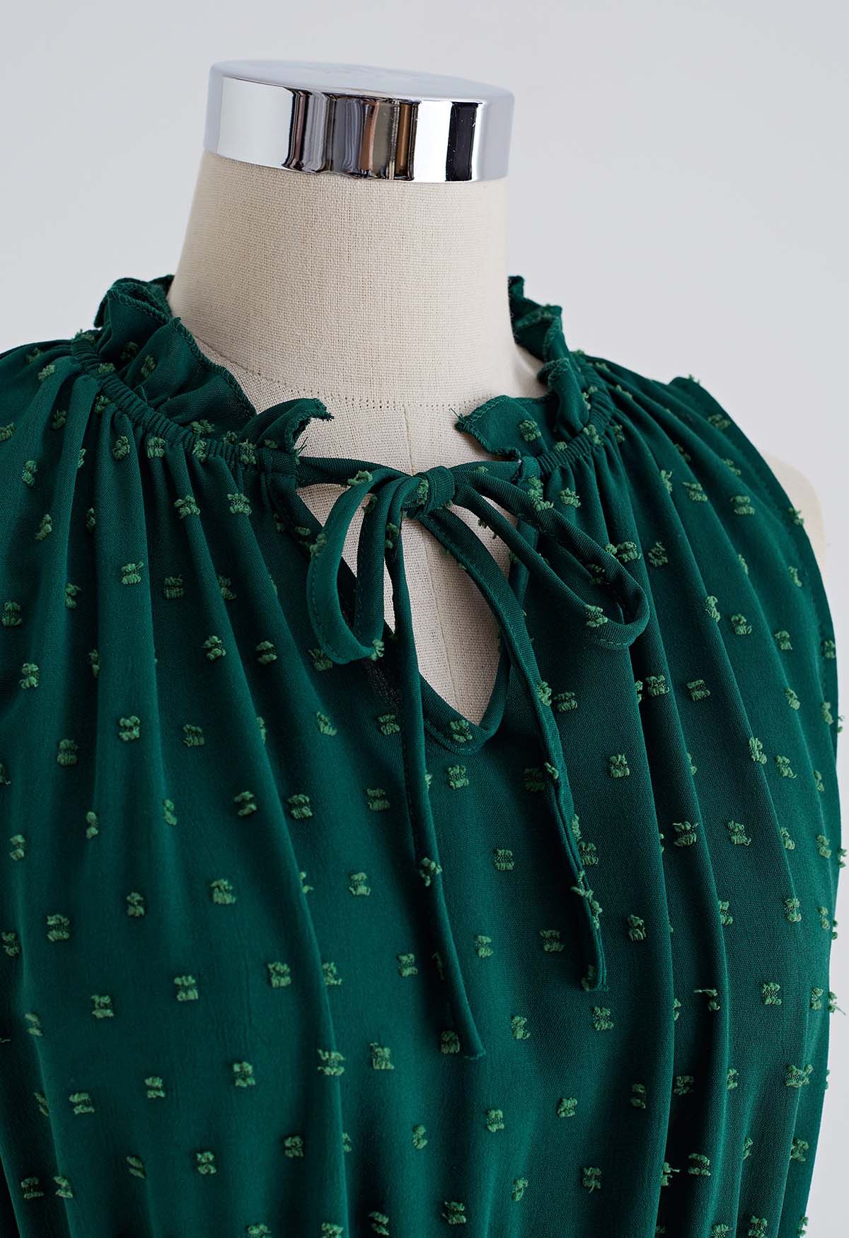 فستان بطيات منقطة وربطة عنق باللون الأخضر الداكن