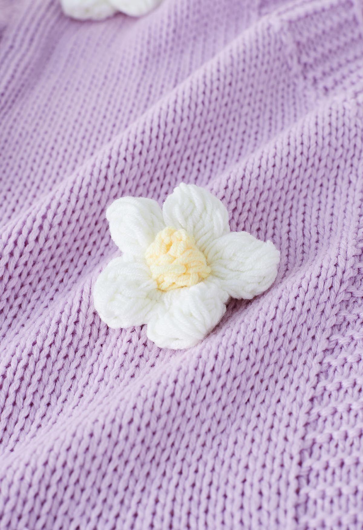 سترة صوفية متماسكة مفتوحة من الأمام بزهرة ثلاثية الأبعاد باللون الأرجواني