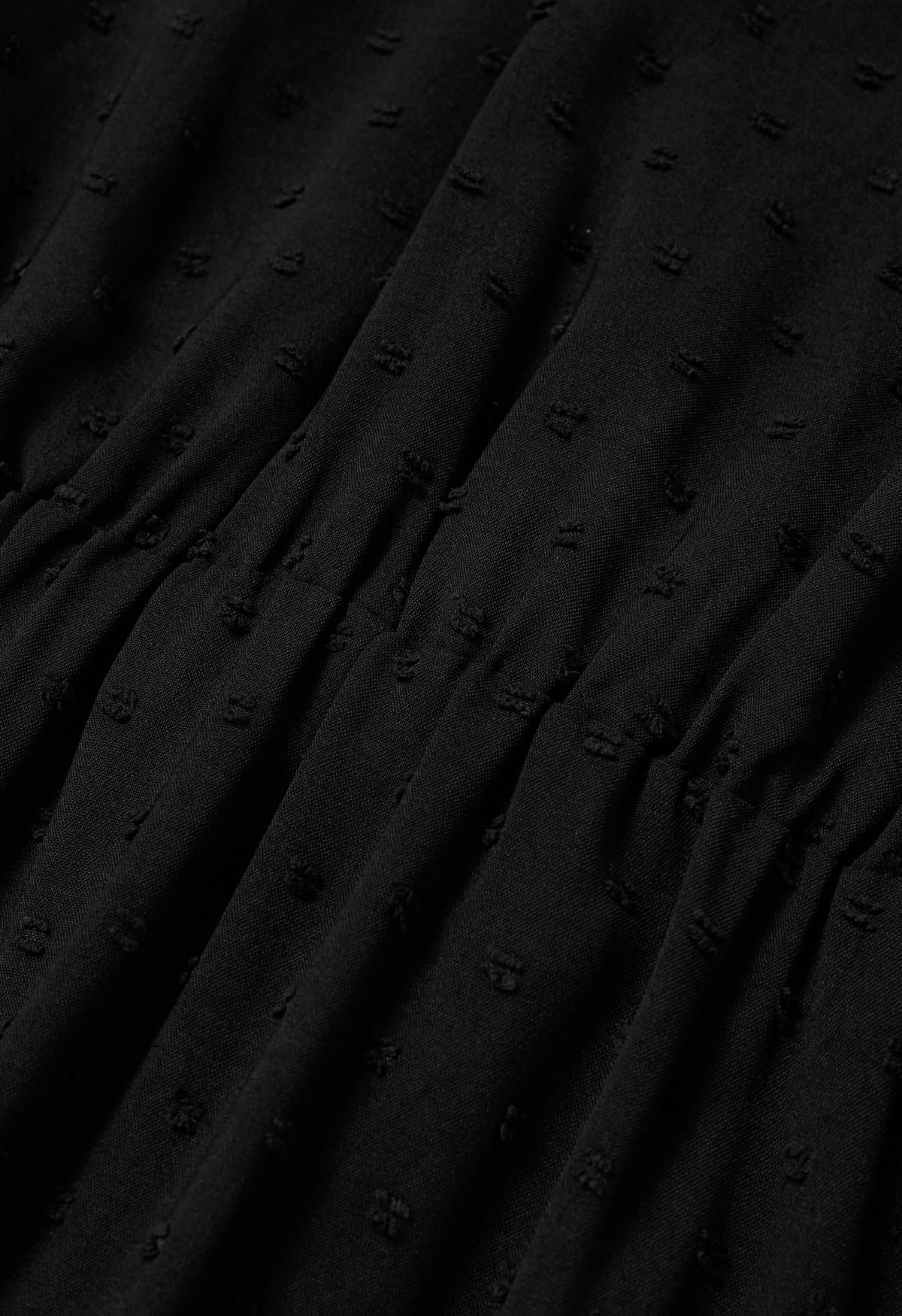 فستان جاكار منقط بحزام ملفوف باللون الأسود