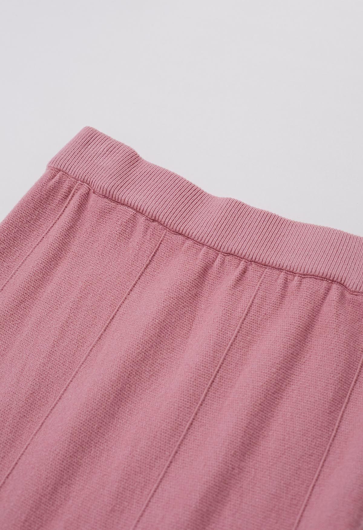 تنورة ميدي منسوجة بحاشية مكشكشة باللون الوردي