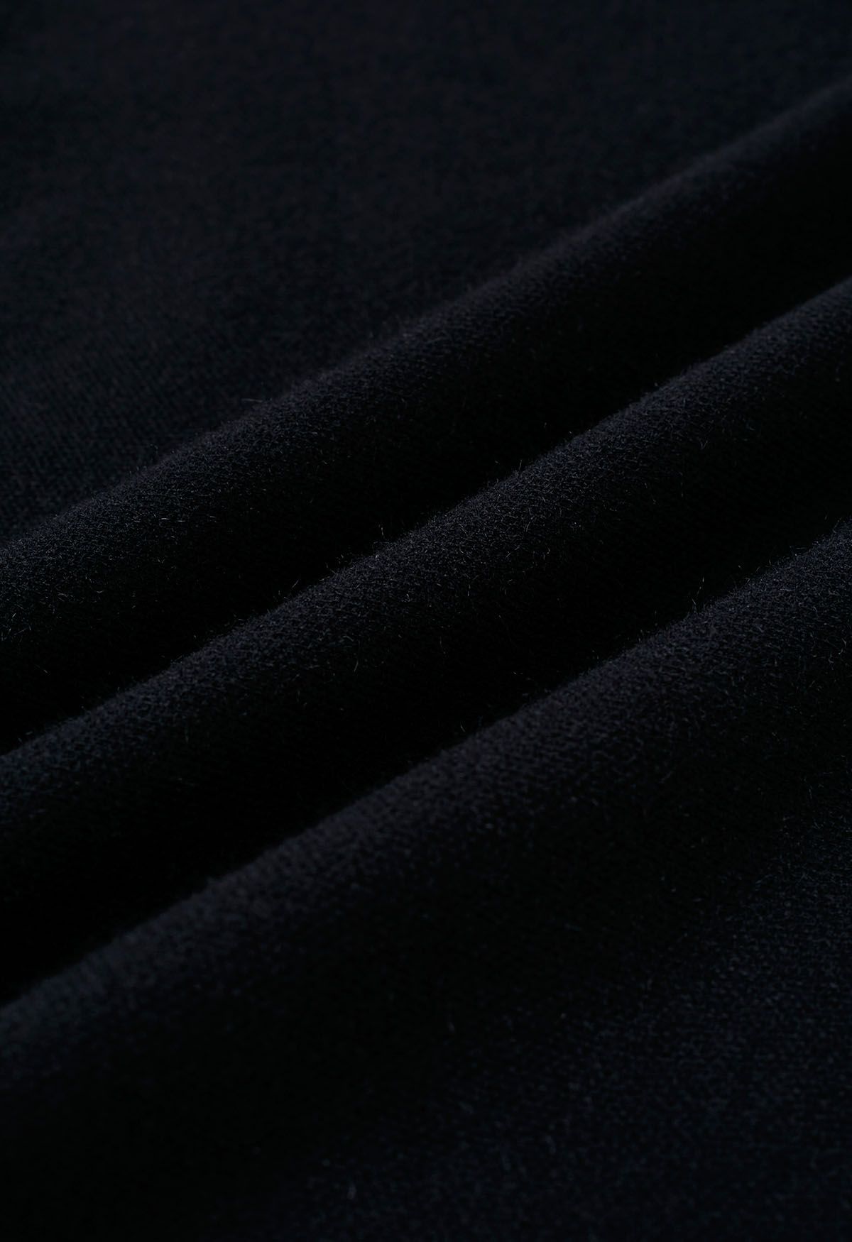 معطف منسوج بأكمام من الفرو الصناعي باللون الأسود