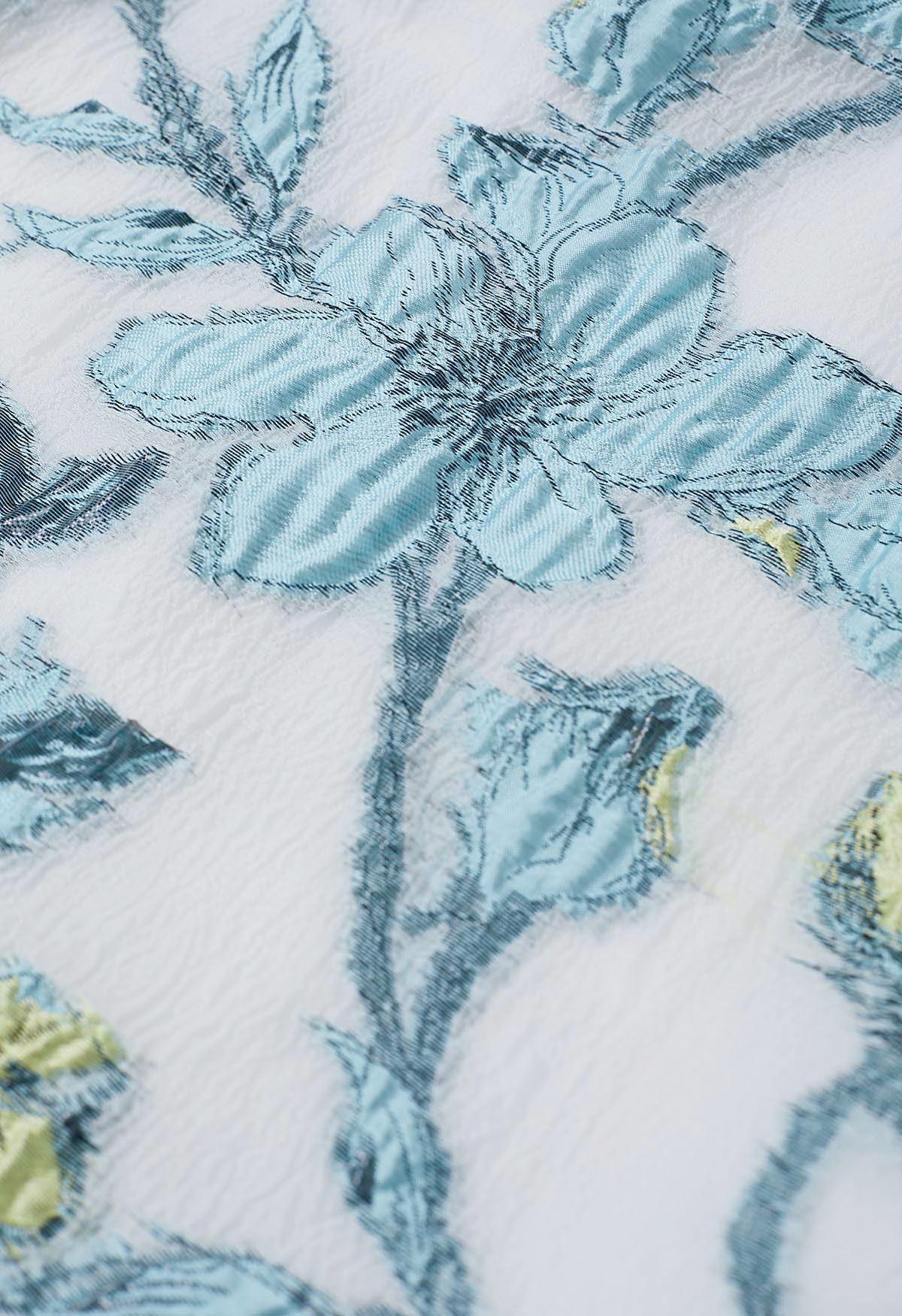 تنورة ميدي جاكار مطوي بنقشة زهور الربيع باللون الأزرق
