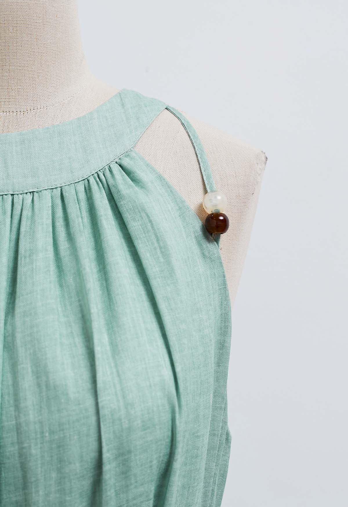 فستان هالتر مطرز بربطة عنق باللون الأخضر البازلاء
