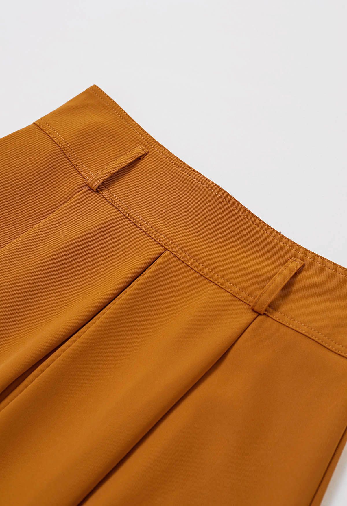 تنورة متوسطة الطول بحزام مطوي باللون البرتقالي