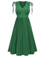 فستان متوسط الطول بطيات بدون أكمام وربطة عنق باللون الأخضر