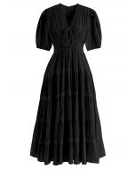 فستان متوسط الطول بفتحة رقبة على شكل V باللون الأسود