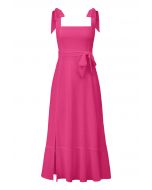 فستان قصير بحافة مكشكشة ورباط على الكتف باللون الوردي الفاتح